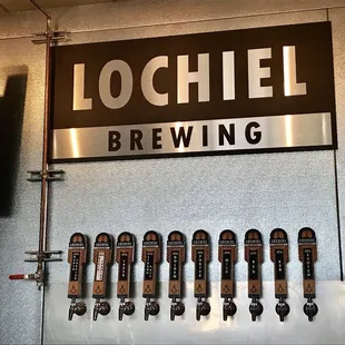 a row of beer taps