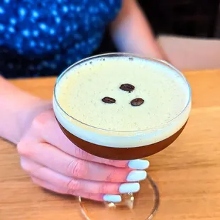 a person holding a drink