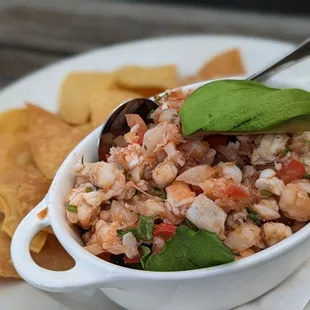 a bowl of seafood and chips