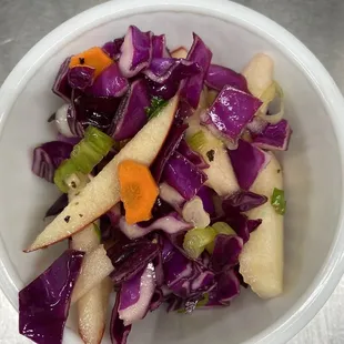 Fisherman slaw:  purple and white cabbage, honey, apple cider vinaigrette, onion, apples, celery, carrots.