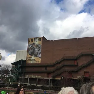 people walking in front of a building