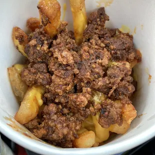 chili cheese fries - battered fries, layered with nacho cheese and chili throughout so all the fries got cheesy chili goodness