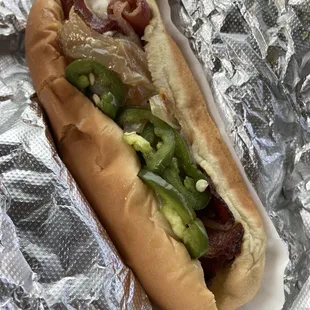 grunge dog - garlic cream cheese, candied jalapeños, bacon, caramelized onions (toppings also available on a burger)