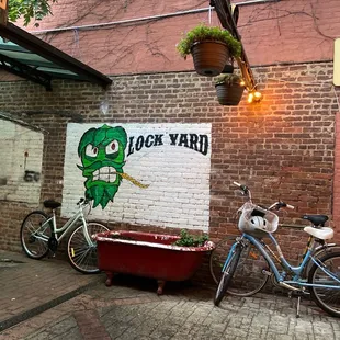 a bicycle parked in front of a brick building