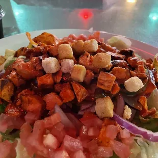 Salad with grilled chicken tossed in hot Buffalo sauce - delicious!