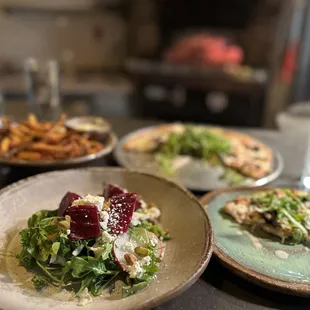 three plates of food on a table