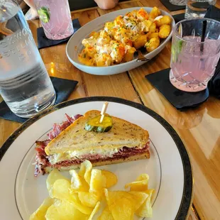 Pastrami sandwich. Dirty tots