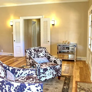 The master bedroom features king size bed and fireside seating, cowboy style!