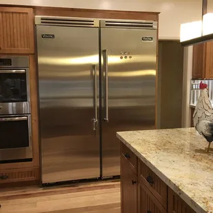 Oversize refrigerator and full freezer.