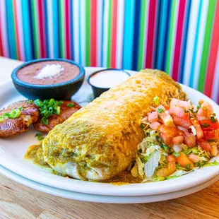 a burrito with a side of salsa