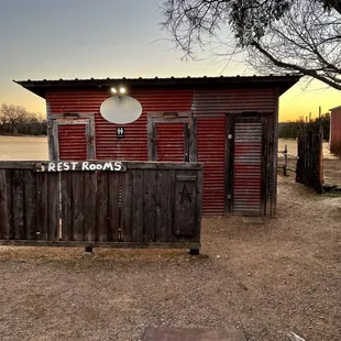 a red building with a sign on it