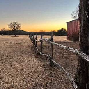 The land behind the restaurant. We saw deer passing as we ate.