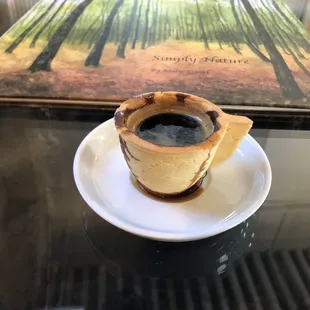 Double shot of espresso in a little biscotti cup!! Fun and delicious!! The watercolor book is by Mary, the owner!!