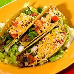 two tacos on a yellow plate