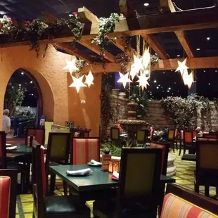 a dining area with tables and chairs