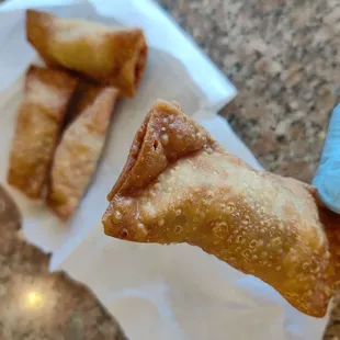 Gau Gee is made by simply folding the filled wonton wrapper in half - no need to twist into an ingot shape like a wonton
