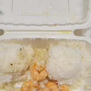 shrimp and rice in a styrofoam container