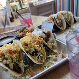 more tacos and ambience you can watch people passing by on their busy day, while you relax, and eat food