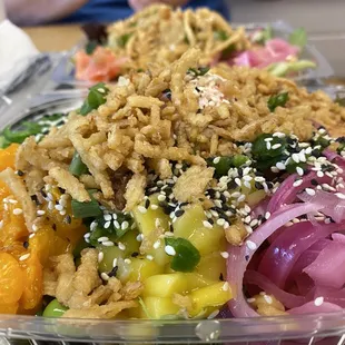 a plastic container filled with rice and vegetables