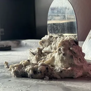 a person cutting dough with a knife