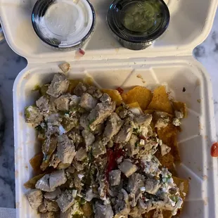 Dry Nachos + chicken ($4) + guac ($2) and yes that is all the guac we got