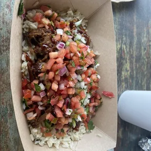 Smoked pork bowl, cilantro lime rice,bbq sauce, pico de gallo, cilantro and onions.