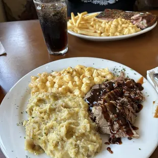 Pull pork, macaroni and cheese with garlic mashed potatoes.