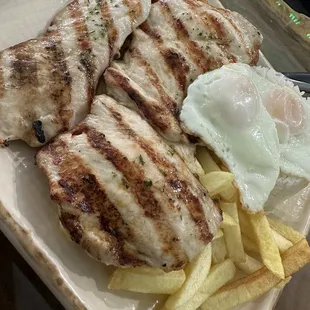 &quot;Pollo Pobre&quot; two grilled chicken breaths, fried egg, fried plantains and white rice