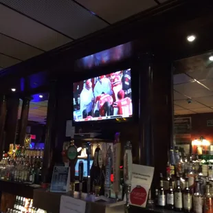 a television in the back of the bar