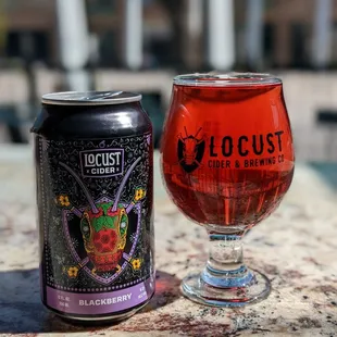 a glass and a can
