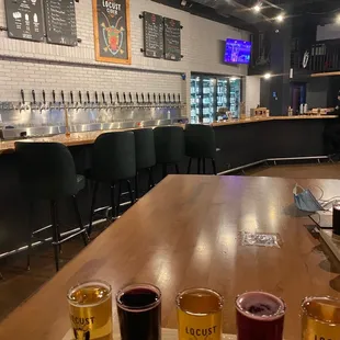 Cider flight with bar in background