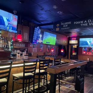 a sports bar with a large screen