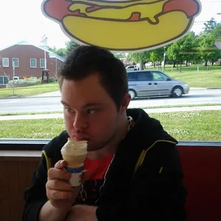 a man eating a hot dog