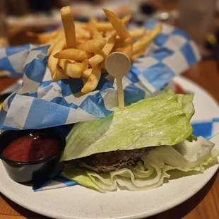 Burger, lettuce wrapped with fries.