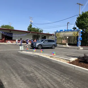 Drive thru graduation for my son&apos;s kindergarten graduation with music and cheering and gifts for the kids.