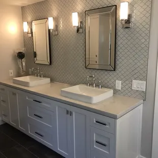 two sinks and mirrors