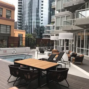 a patio with a table and chairs
