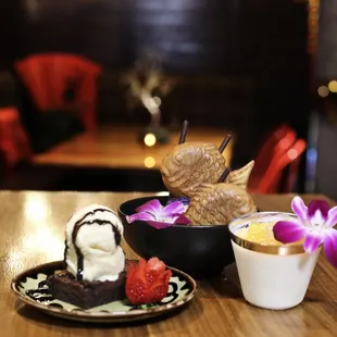 a table with desserts and drinks