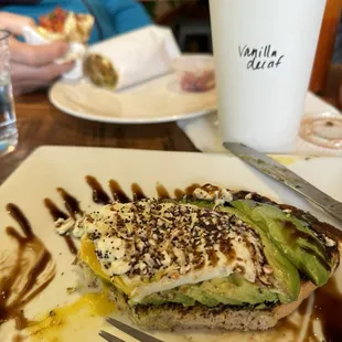 Avocado toast, latte, and breakfast burrito