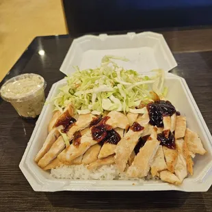 The chicken breast teriyaki with cabbage salad and macaroni salad.