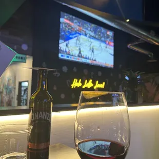 a glass of wine and a bottle of wine