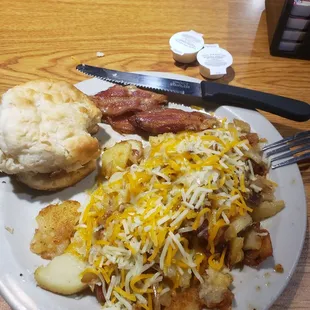Ordered from the sides menu.. buiscutt, bacon, loaded sliced potatoes.