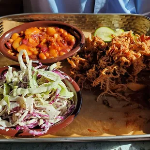 Pulles pork entree with cole slaw and baked beans
