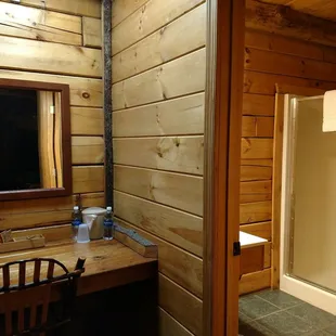 Love all the wood! Nice dressing area, roomy bathroom.