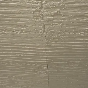 One of many drywall/ceiling cracks.