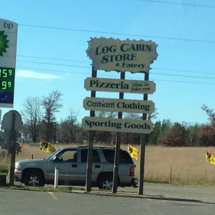 a truck parked in front of a gas station