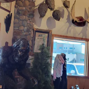 a woman standing in front of a window