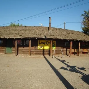 the front of a log cabin