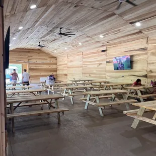 Covered outdoor area with fans and TVs