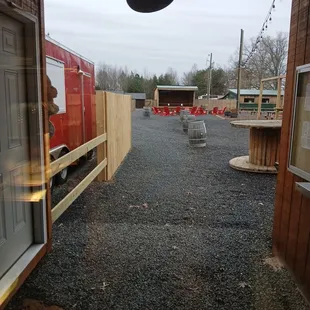 Outdoor entertainment area with stage and hand made furniture